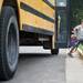 A young student gets off a bus at Abbot Elementary School on Tuesday morning. Daniel Brenner I AnnArbor.com